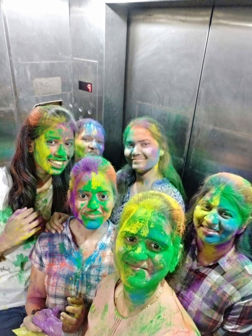 Coconnex team members covered in colour, celebrating Holi together